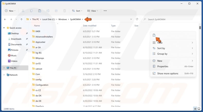 Right-click anywhere in the folder and click Paste